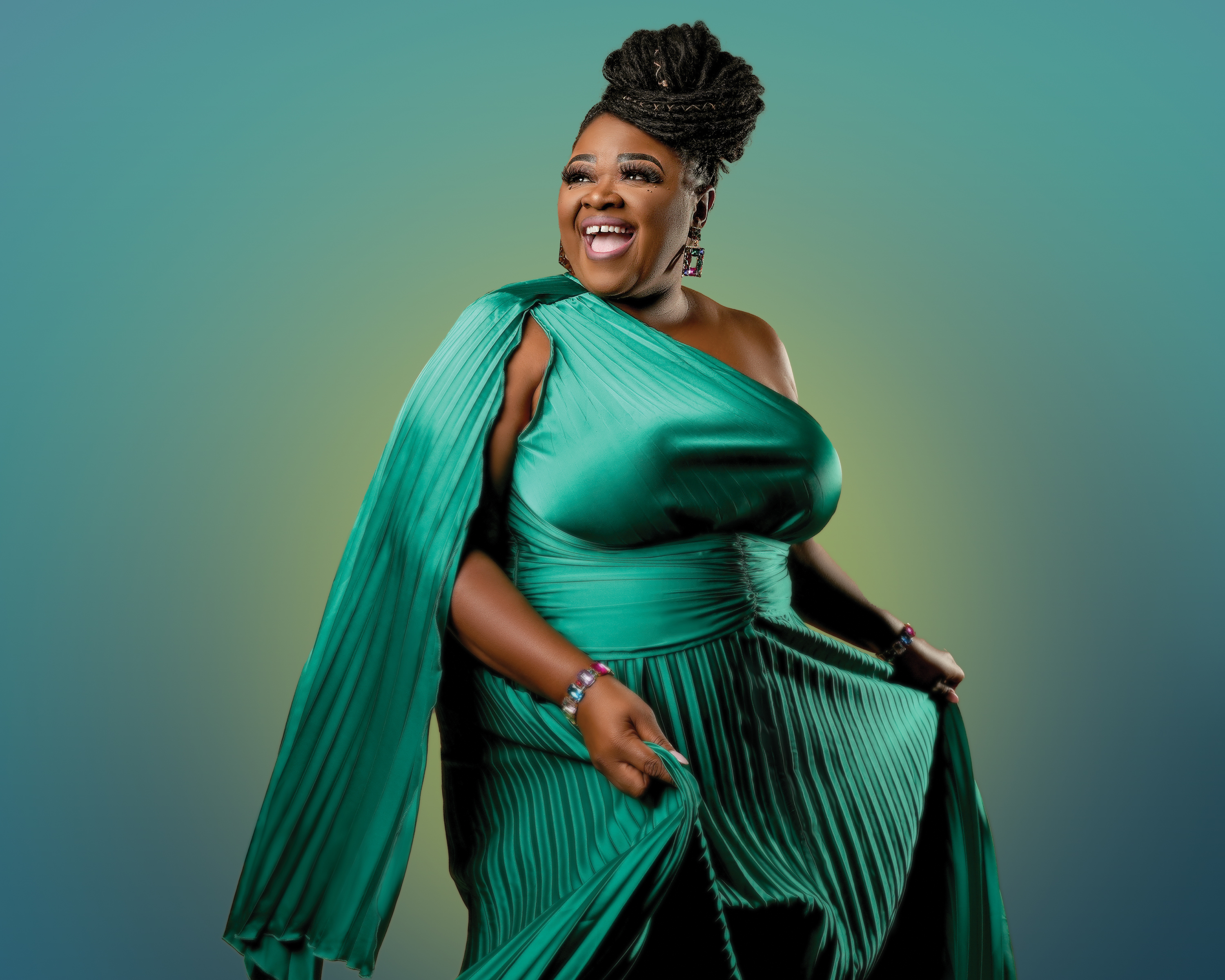 women dressed in a green gown with a green and yellow background singing